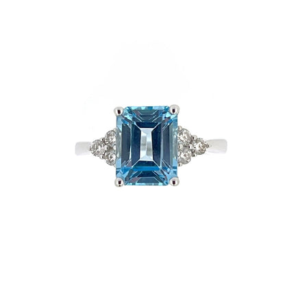 9ct White Gold Emerald Cut Blue Topaz & Diamond Set Dress Ring