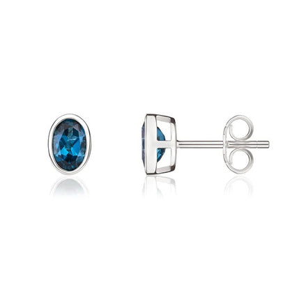 9ct White Gold Oval Blue Topaz Rubover Set Stud Earrings